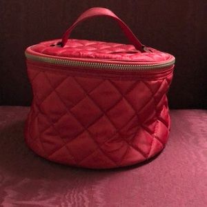 Red quilted round zippered cosmetic case